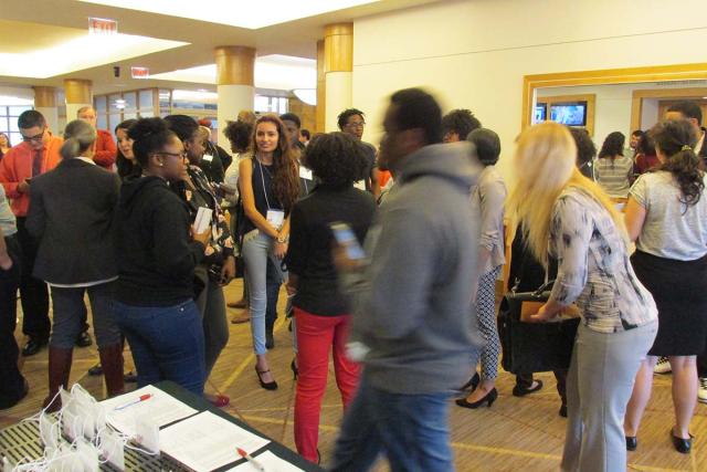 Students walk around an exhibition hall